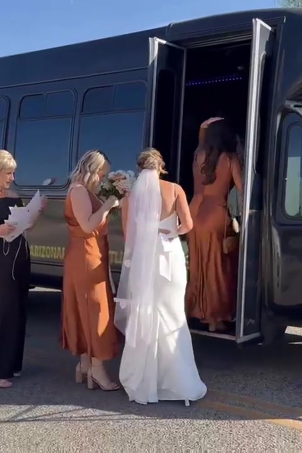 Bride and bridesmaids party bus wedding celebration
