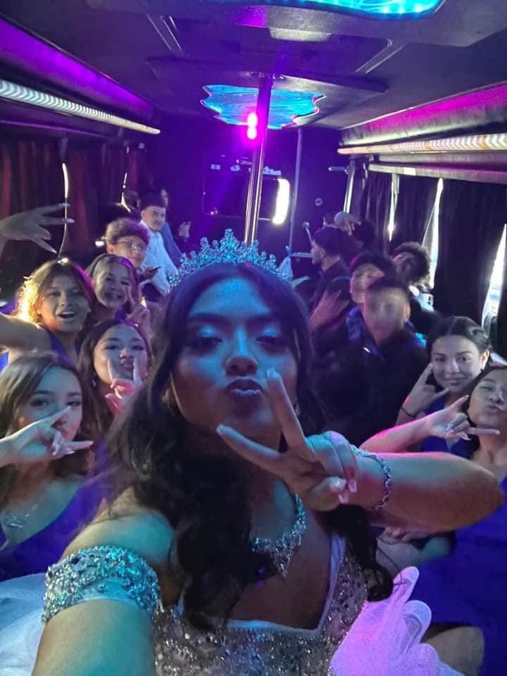 Quincea&ntilde;era party bus group selfie celebration